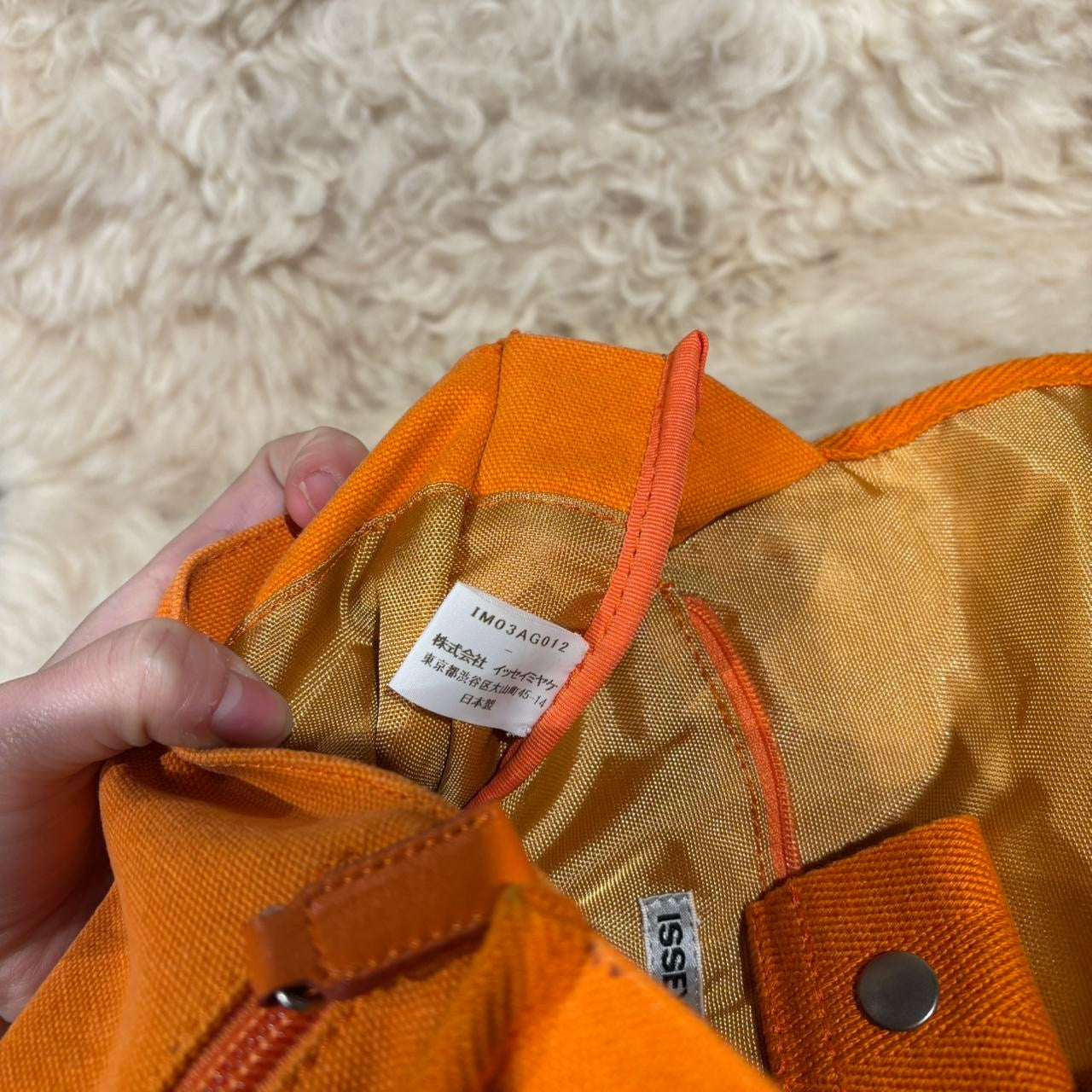 Issey Miyake orange canvas crossbody satchel with adjustable strap