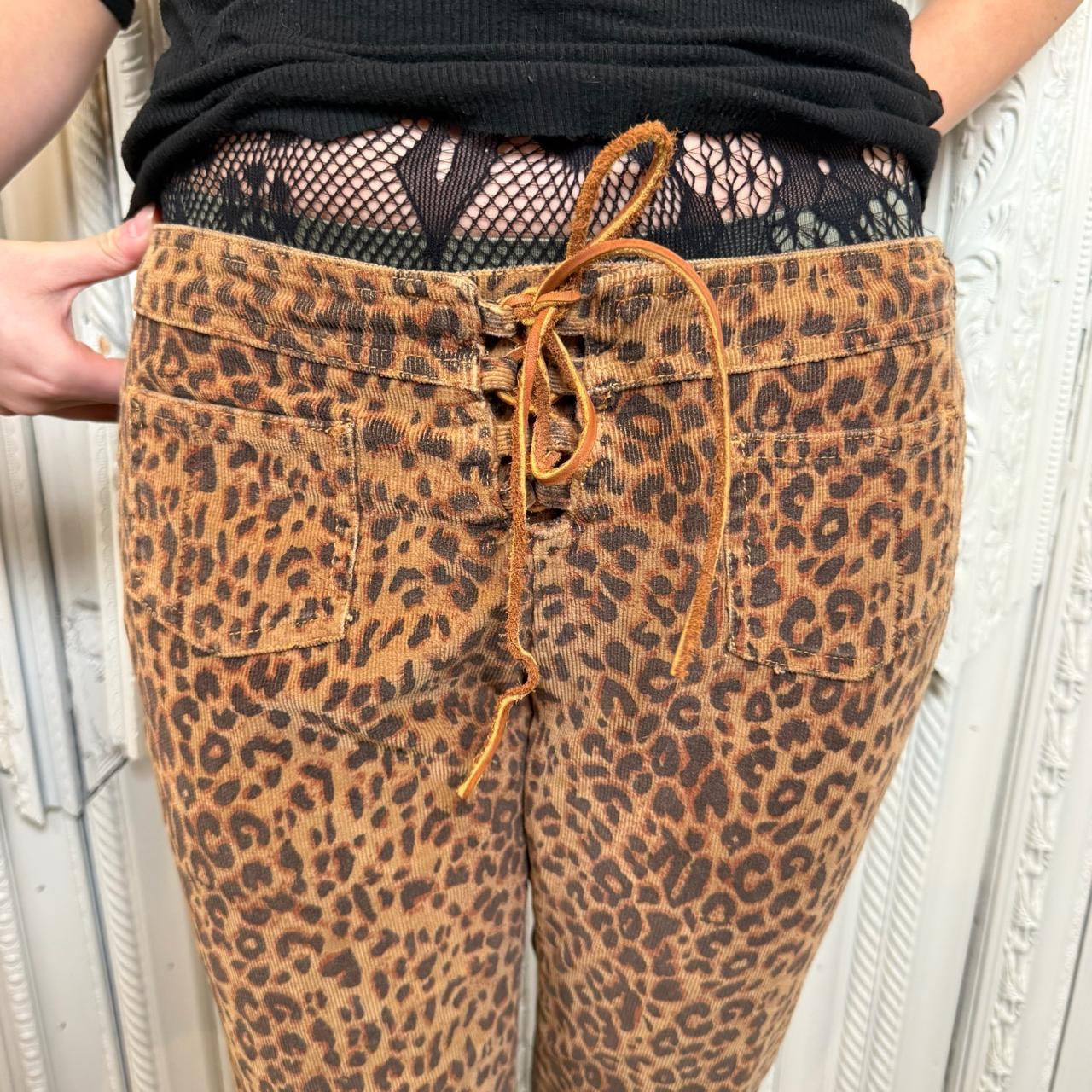 L.E.I. leopard print low rise flare corduroy pants with leather lace up detail