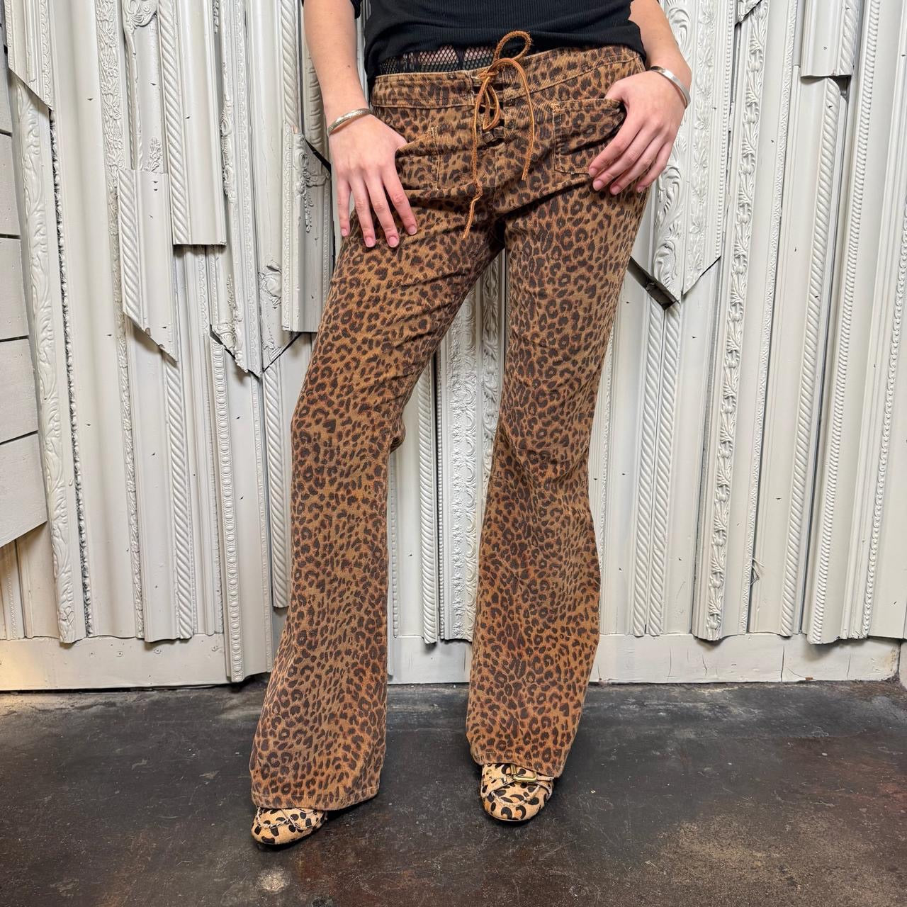 L.E.I. leopard print low rise flare corduroy pants with leather lace up detail