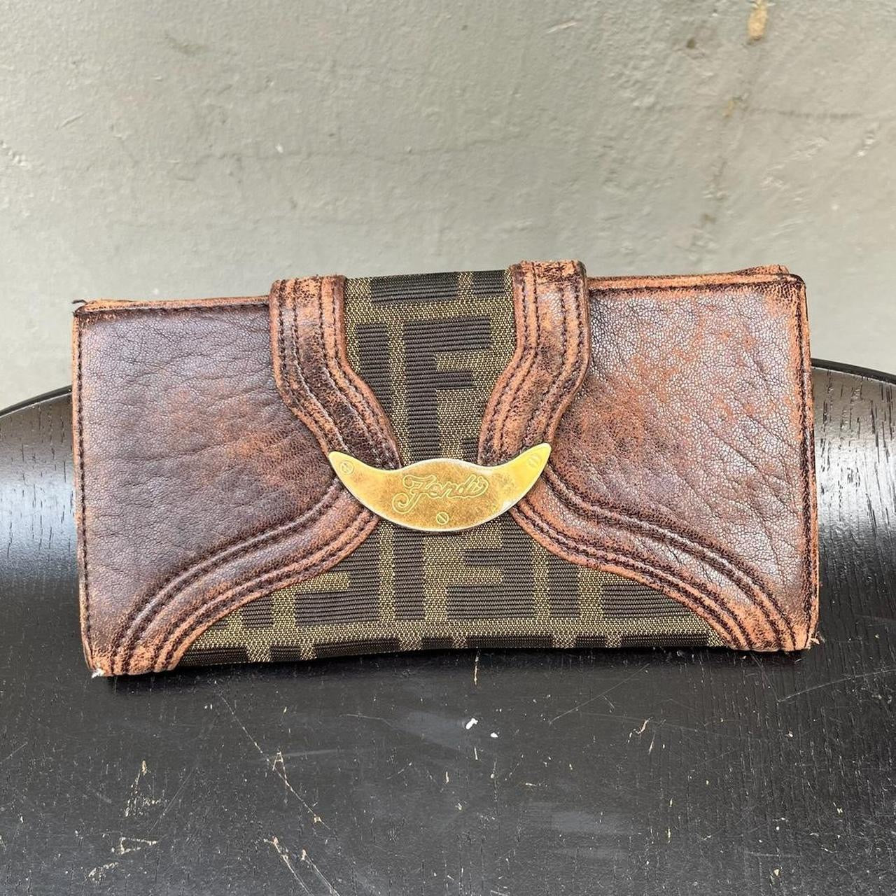 vintage Fendi leather wallet with unique design clasp