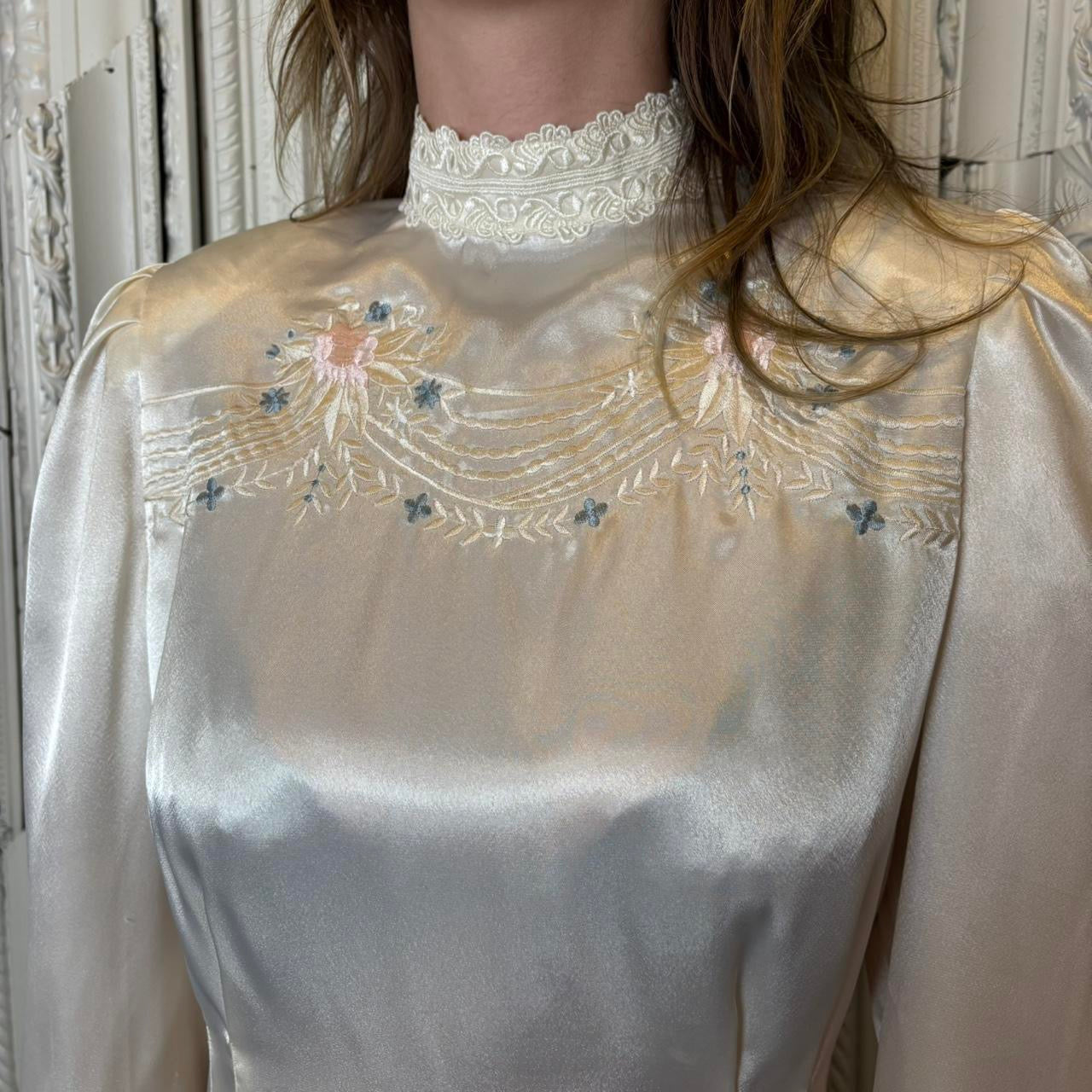 Nilani white polyester stain blouse with embroidery