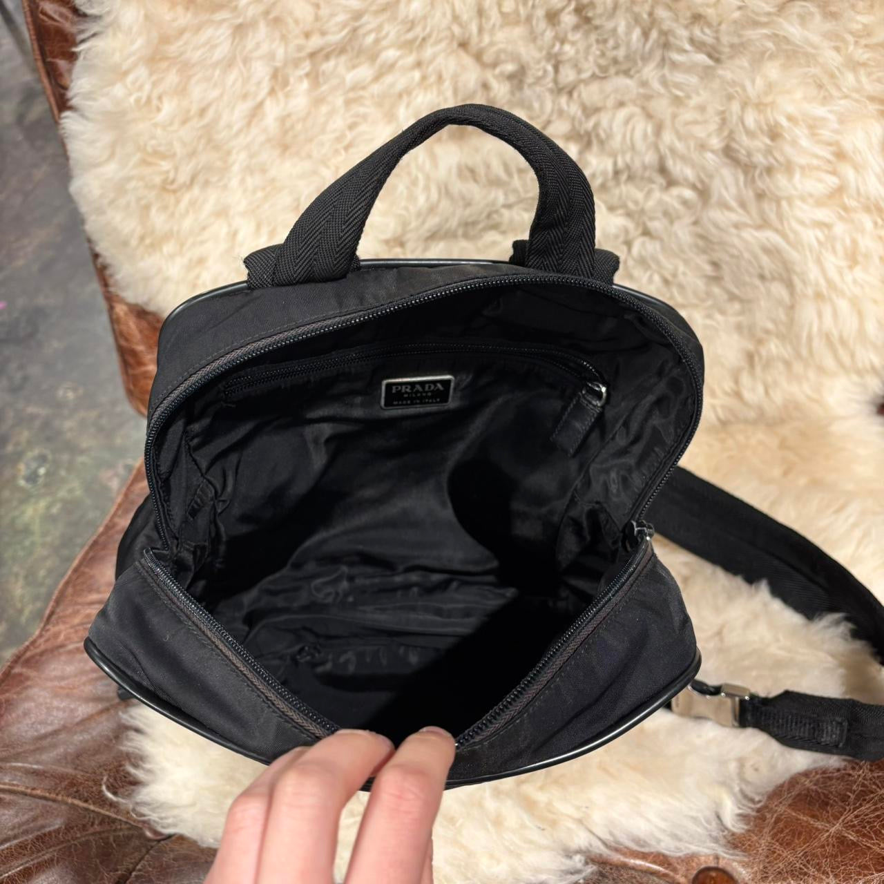 Prada black nylon backpack with silver buckle hardware