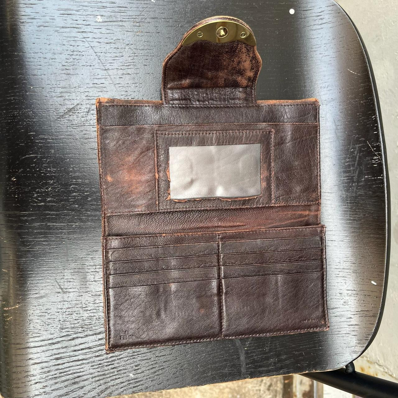 vintage Fendi leather wallet with unique design clasp