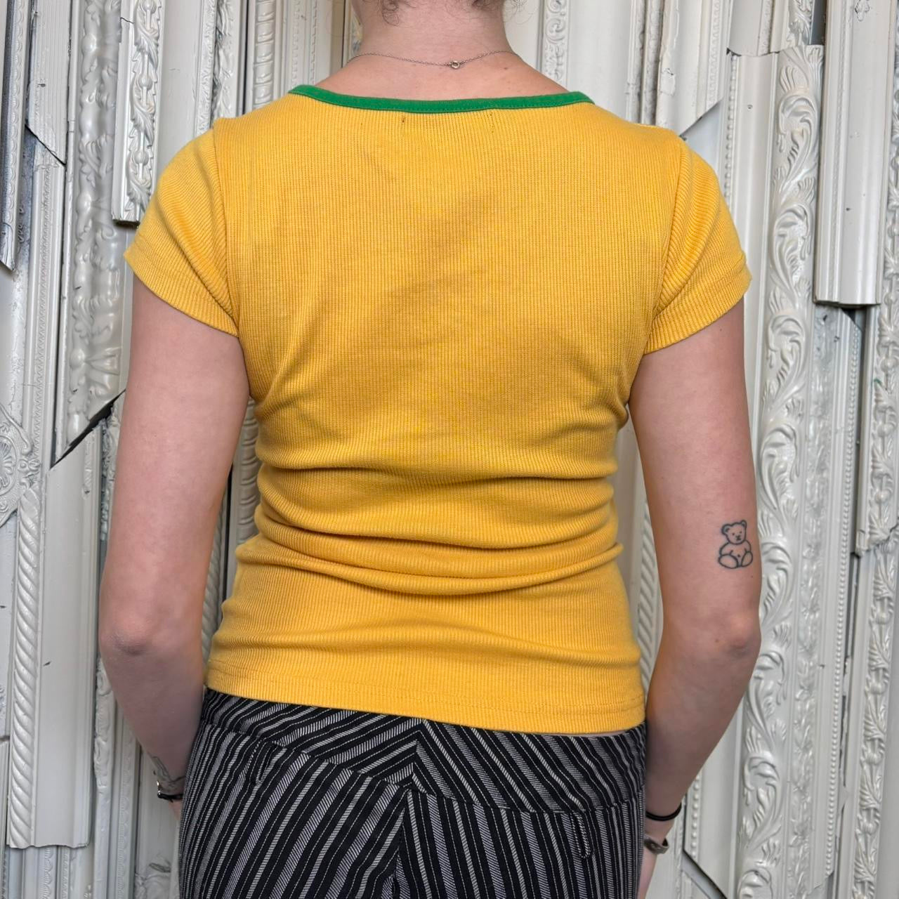 Calm yellow graphic baby tee with rhinestone detailing