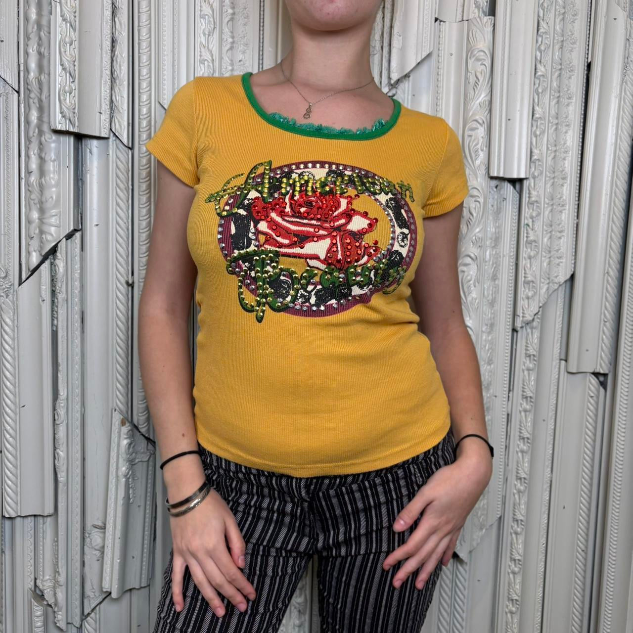 Calm yellow graphic baby tee with rhinestone detailing