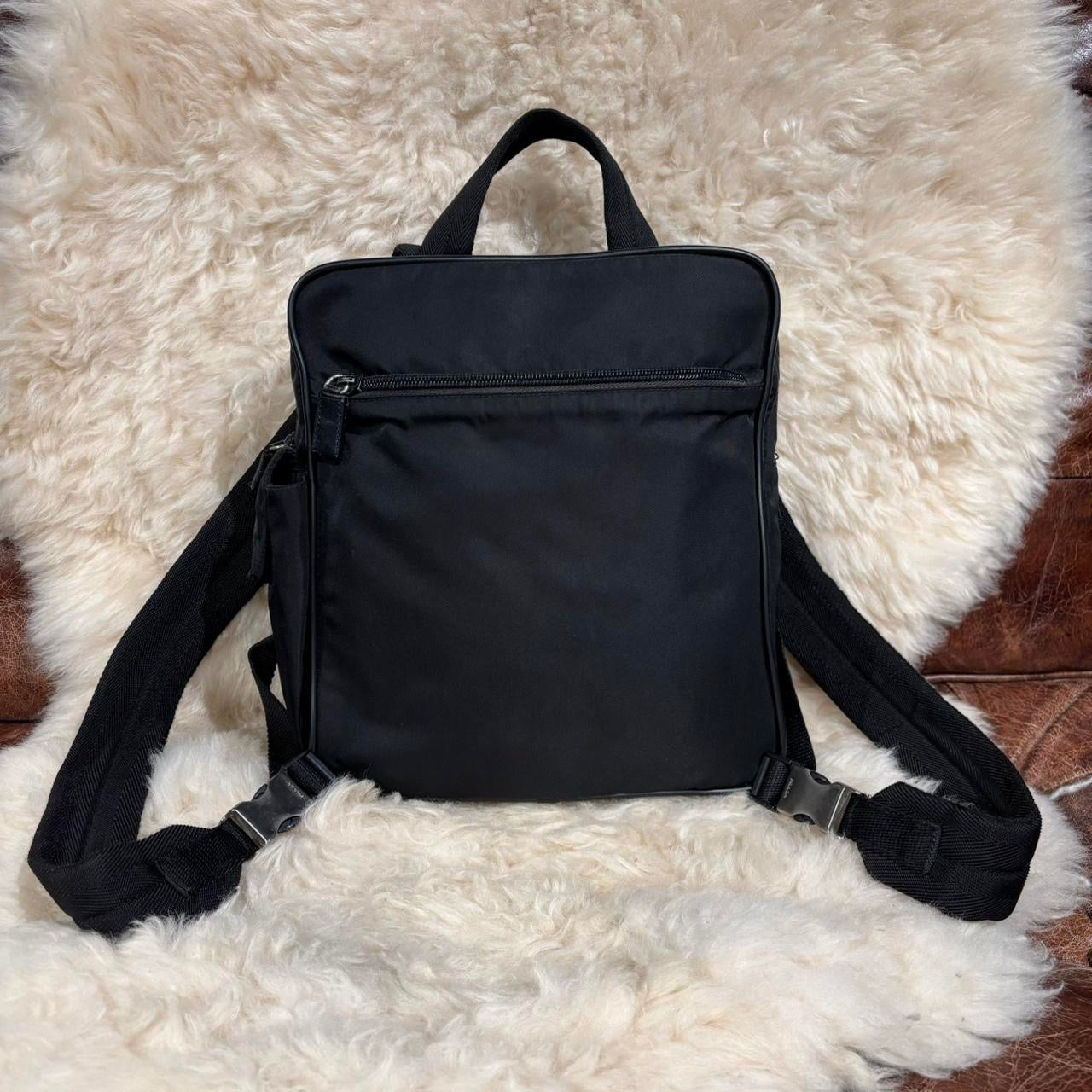 Prada black nylon backpack with silver buckle hardware