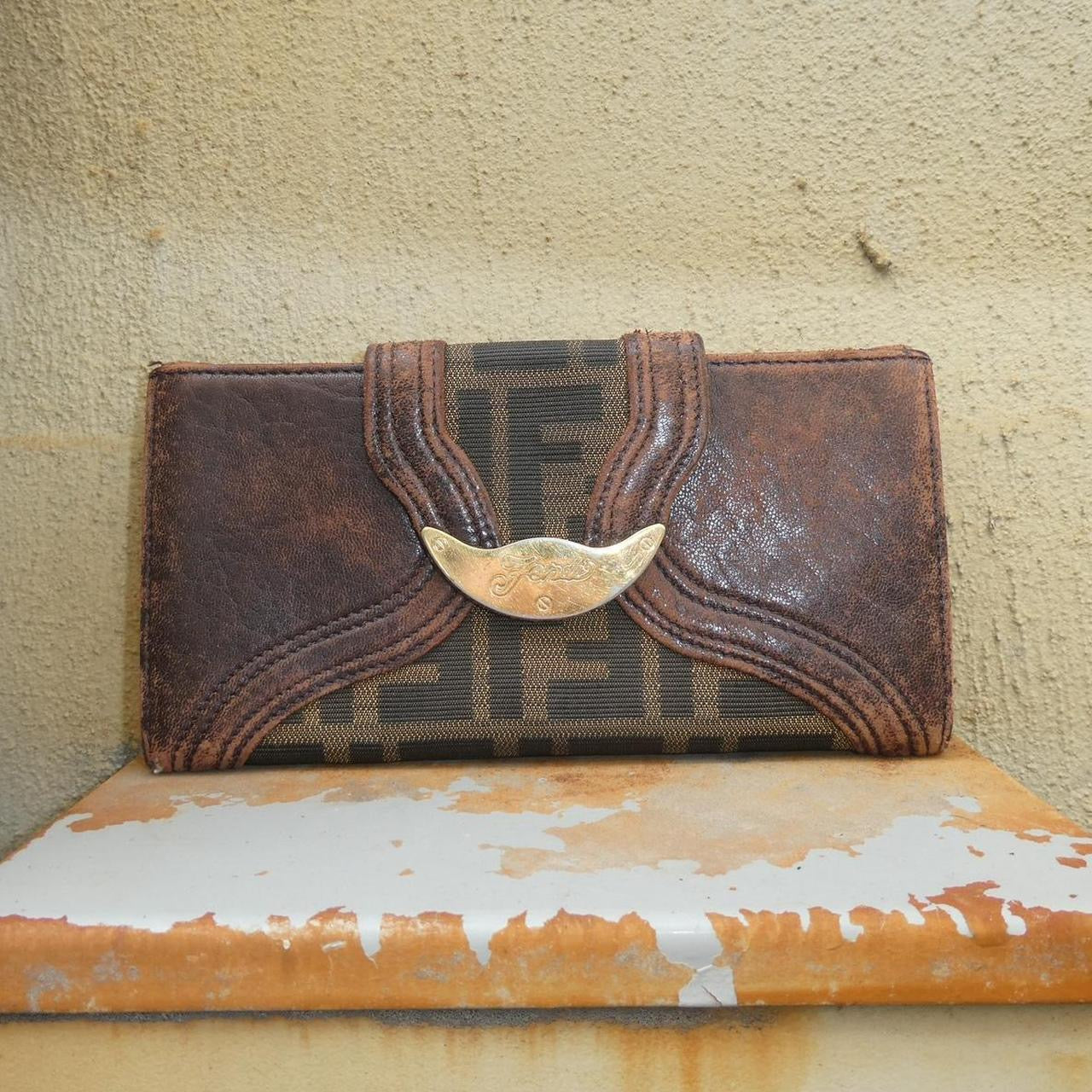 vintage Fendi leather wallet with unique design clasp