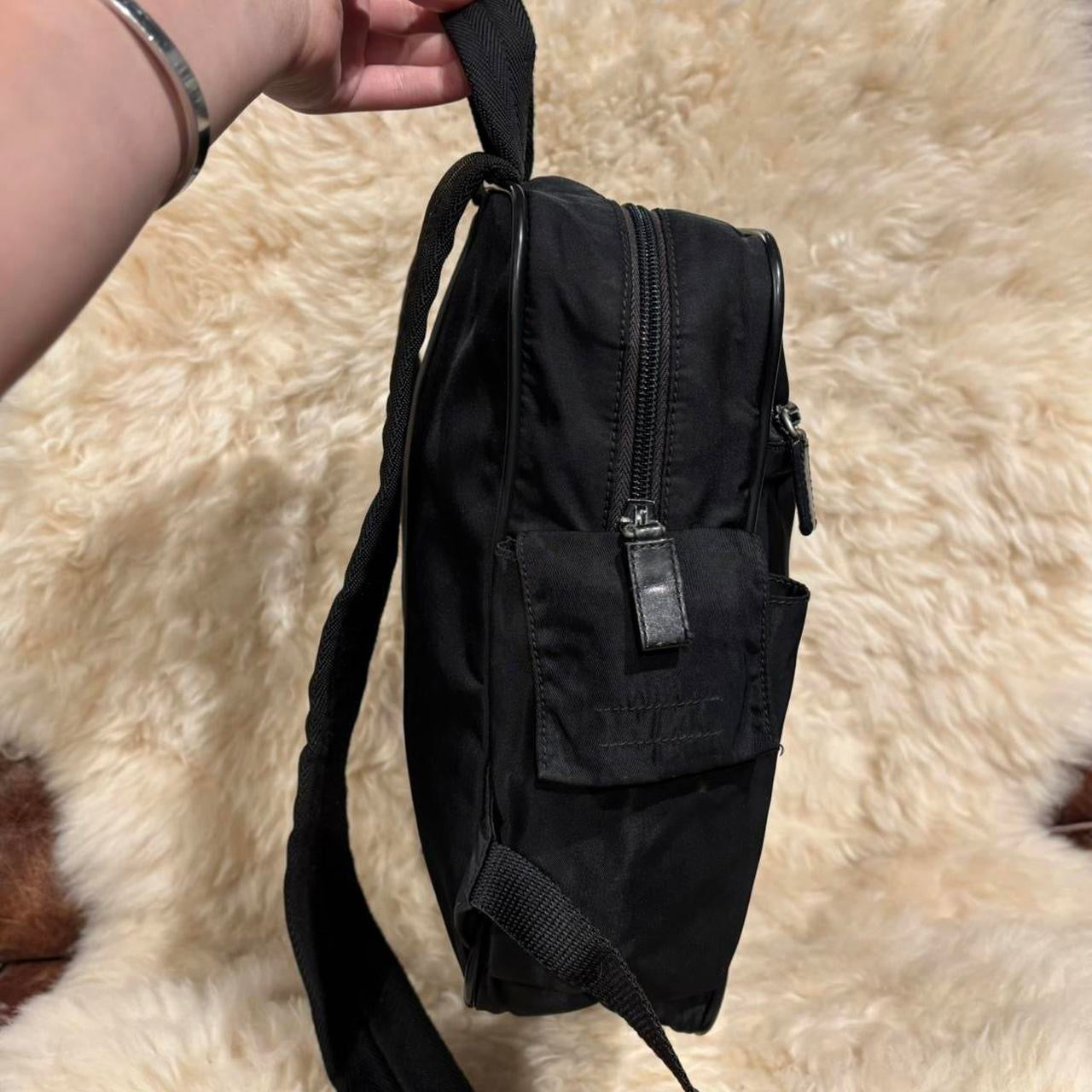 Prada black nylon backpack with silver buckle hardware