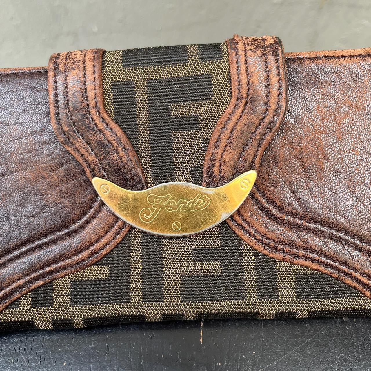 vintage Fendi leather wallet with unique design clasp