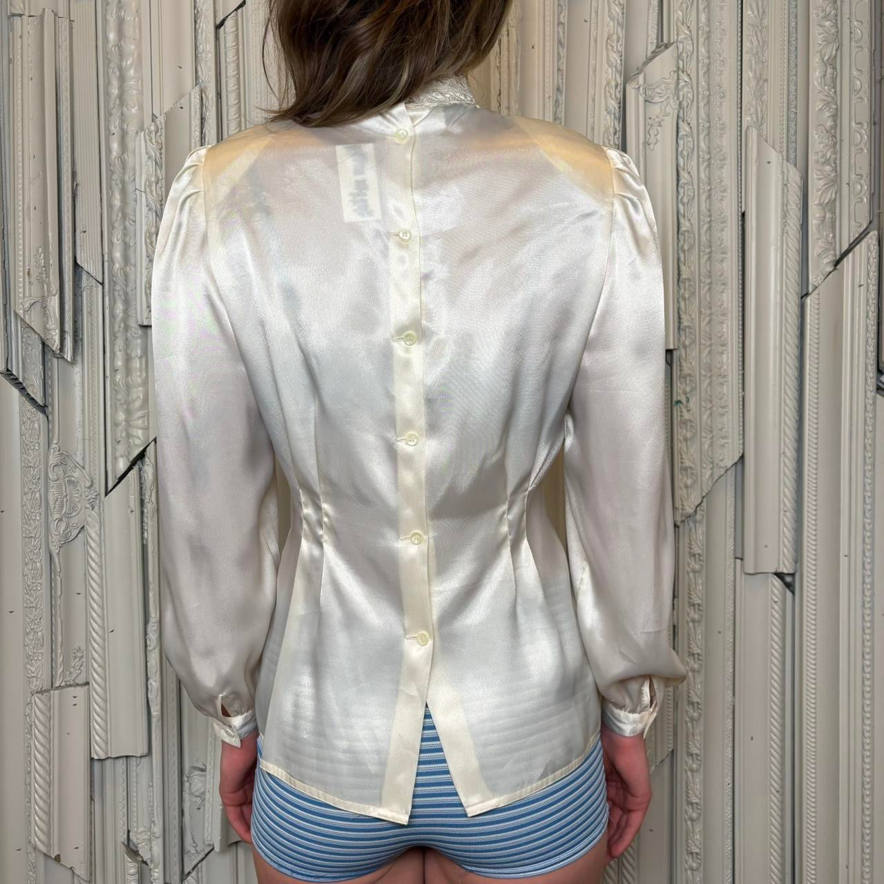 Nilani white polyester stain blouse with embroidery