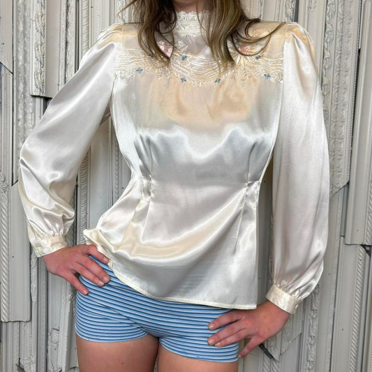 Nilani white polyester stain blouse with embroidery