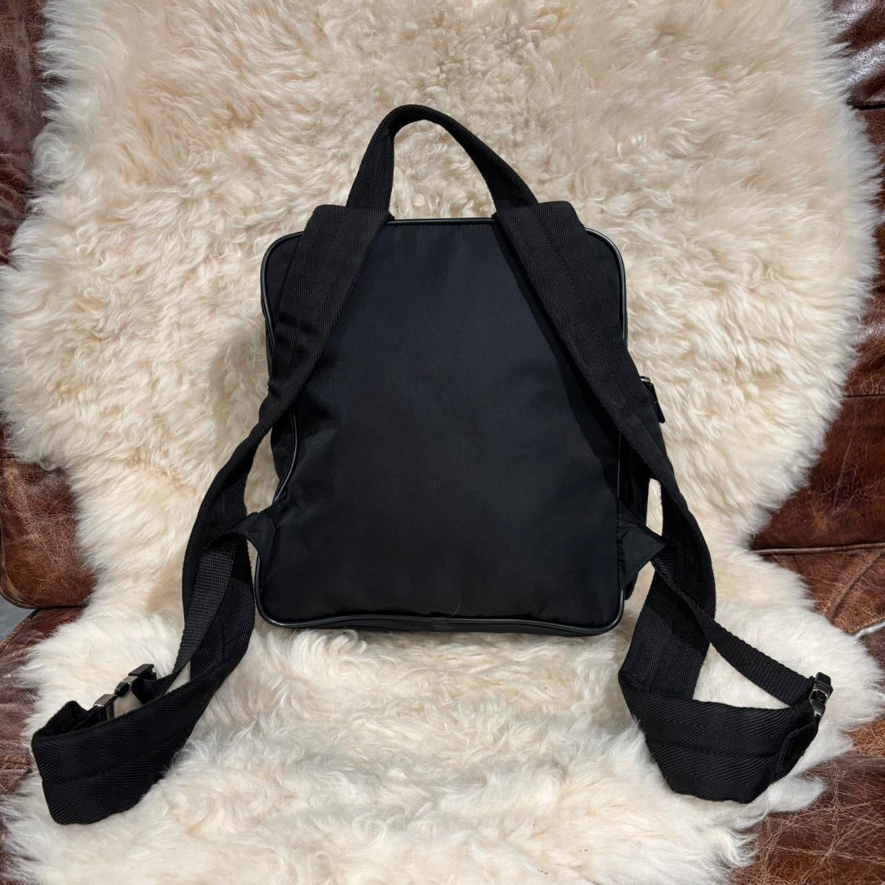 Prada black nylon backpack with silver buckle hardware