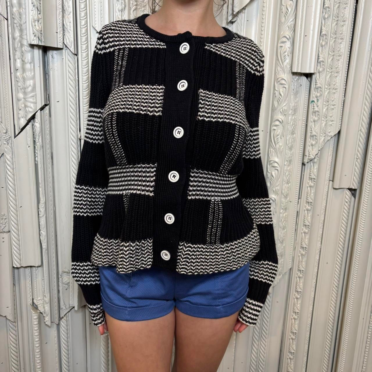 Harold’s black and white cotton knit peplum sweater