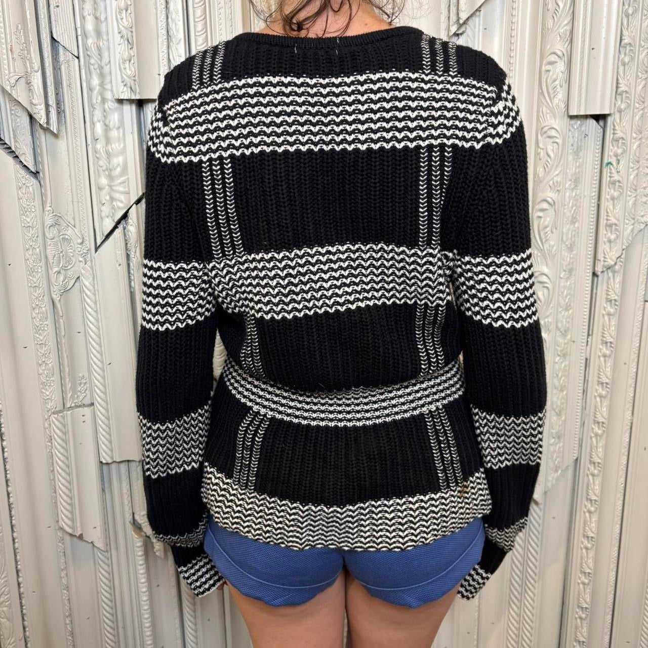 Harold’s black and white cotton knit peplum sweater